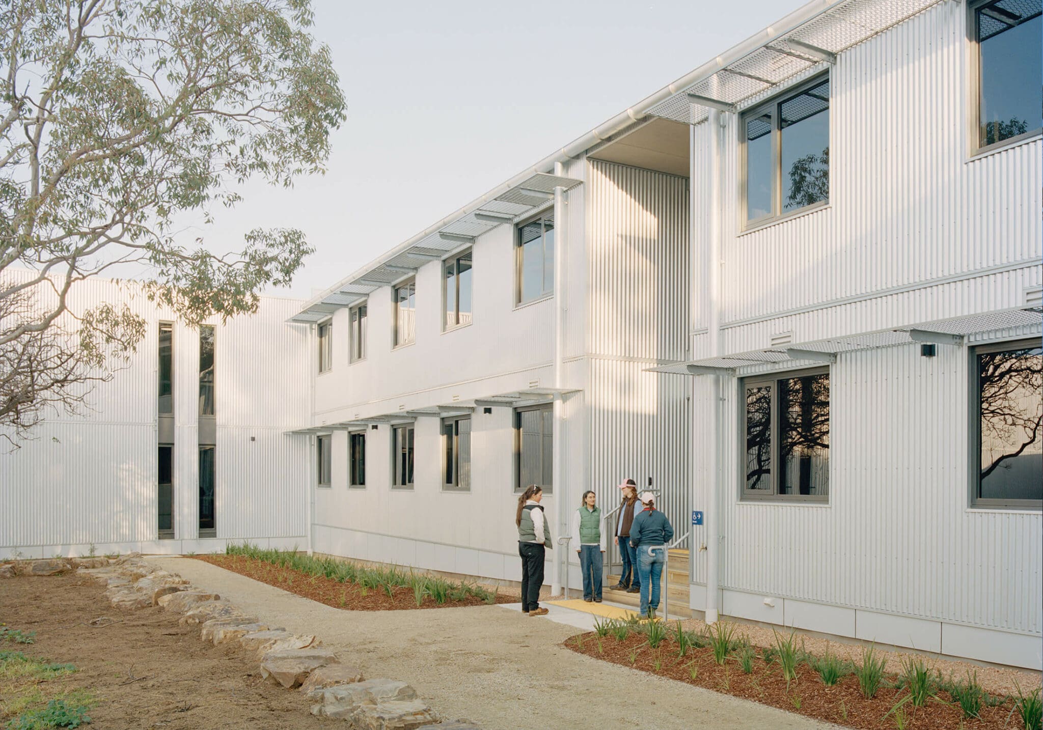 a group of people standing outside of a building