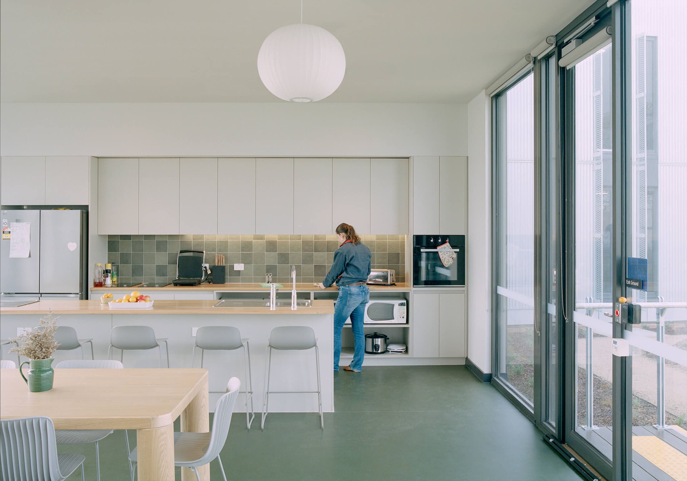 a person standing in a kitchen
